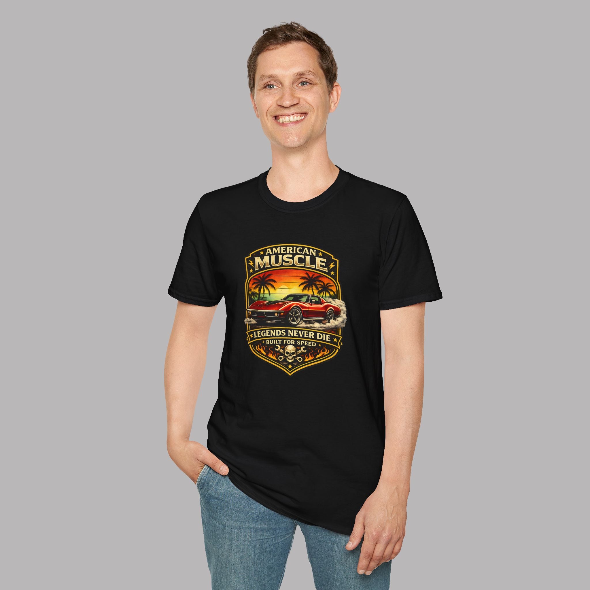 Man wearing a black t-shirt with a classic car graphic design on a gray background