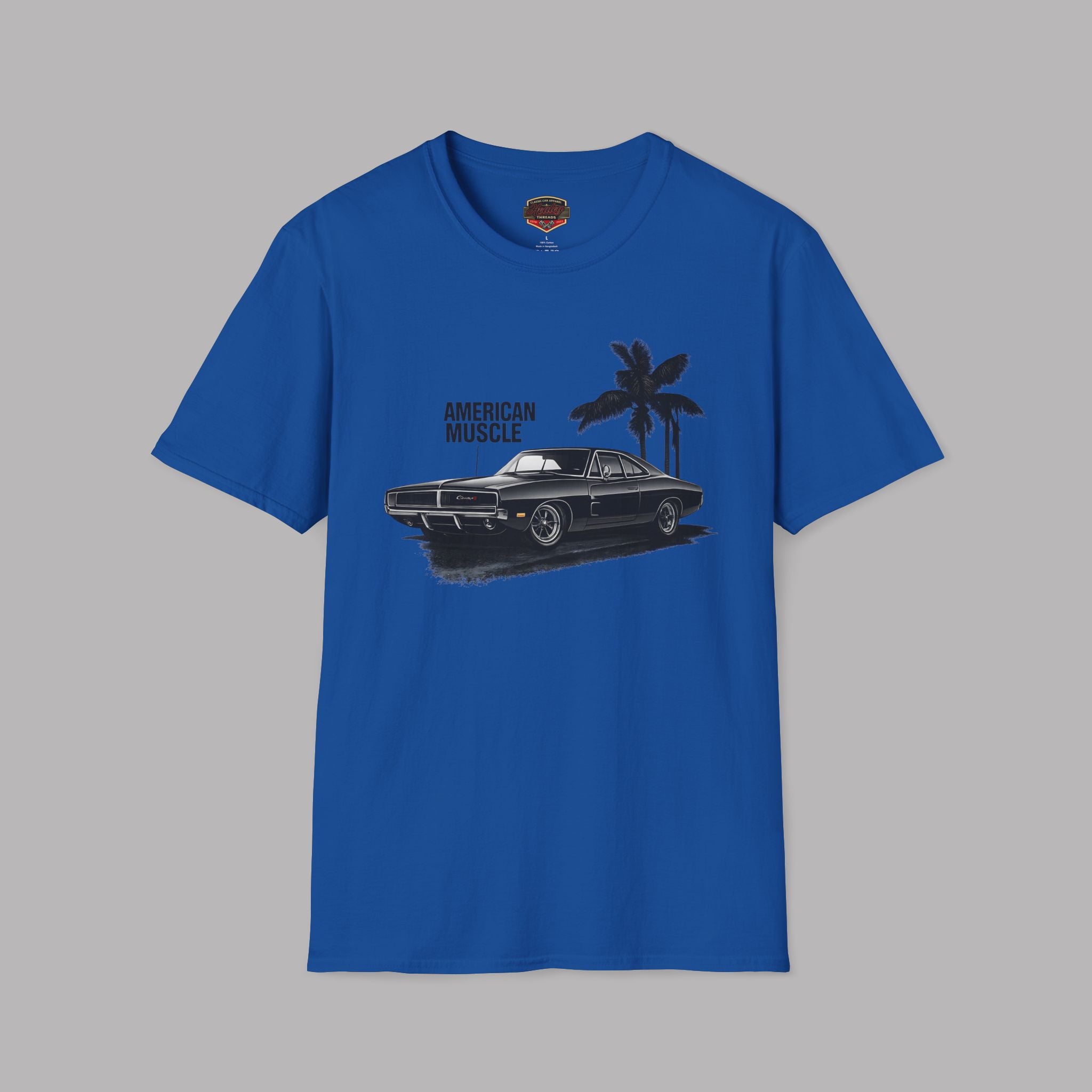Royal blue t-shirt with a graphic of a muscle car and palm trees on a gray background