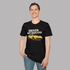 Man wearing a black t-shirt with a yellow muscle car graphic and text on a gray background