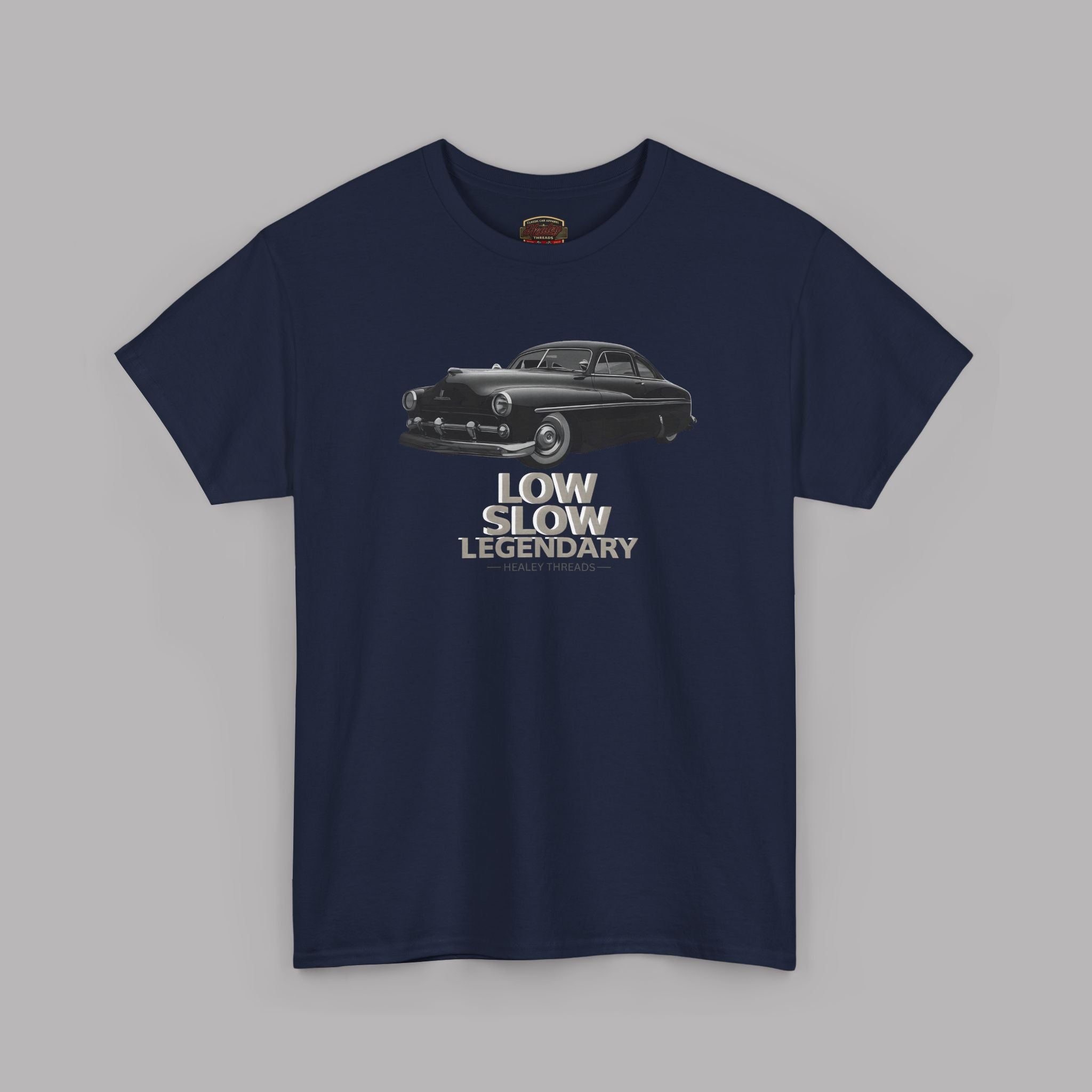 Navy blue t-shirt with a graphic of a black car and text 'LOW SLOW LEGENDARY' on a gray background
