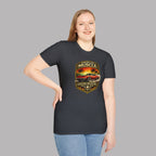 Woman wearing a dark heather t-shirt with a graphic of a classic car and text on a gray background