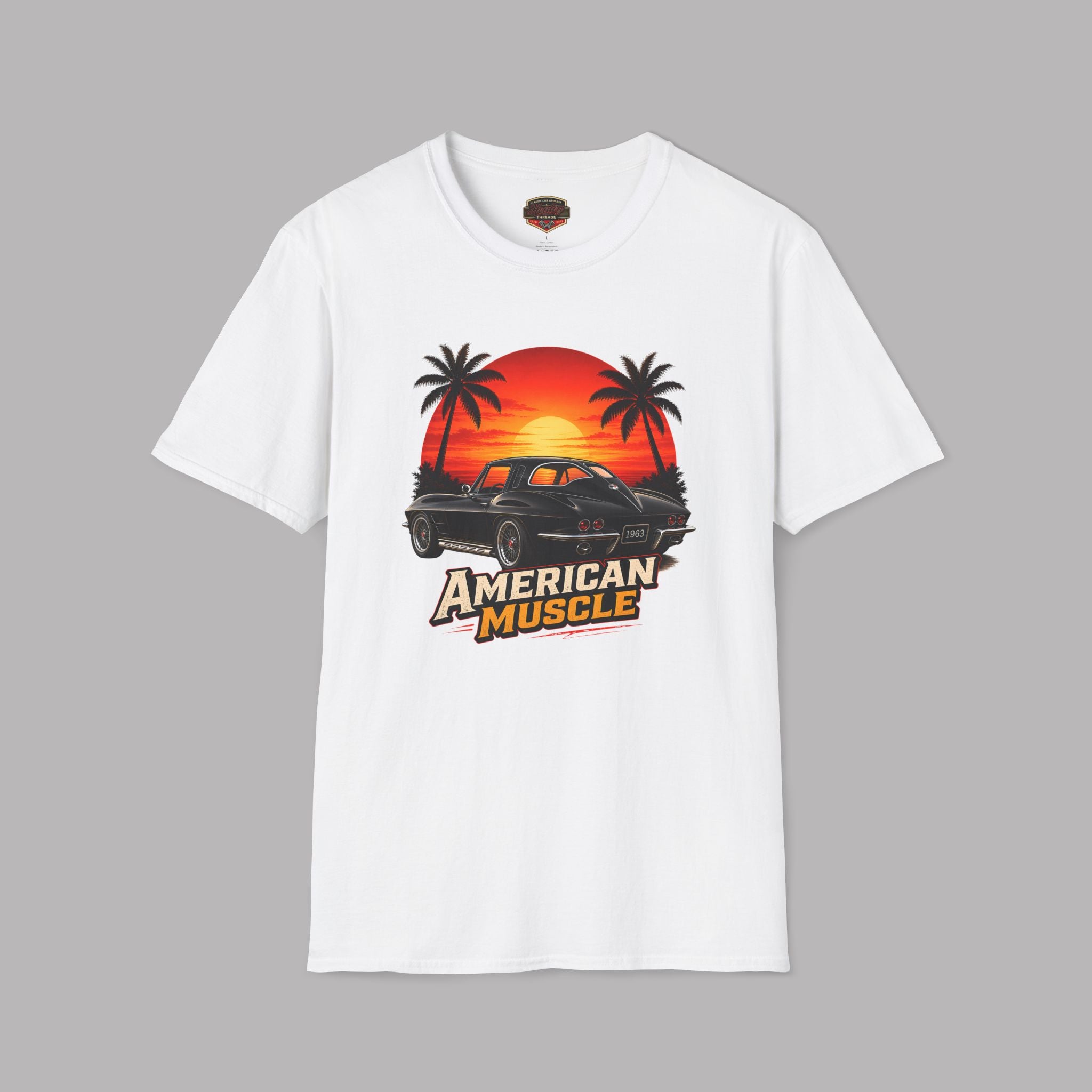 White t-shirt with 'American Muscle' graphic design featuring a sunset and palm trees on a gray background.
