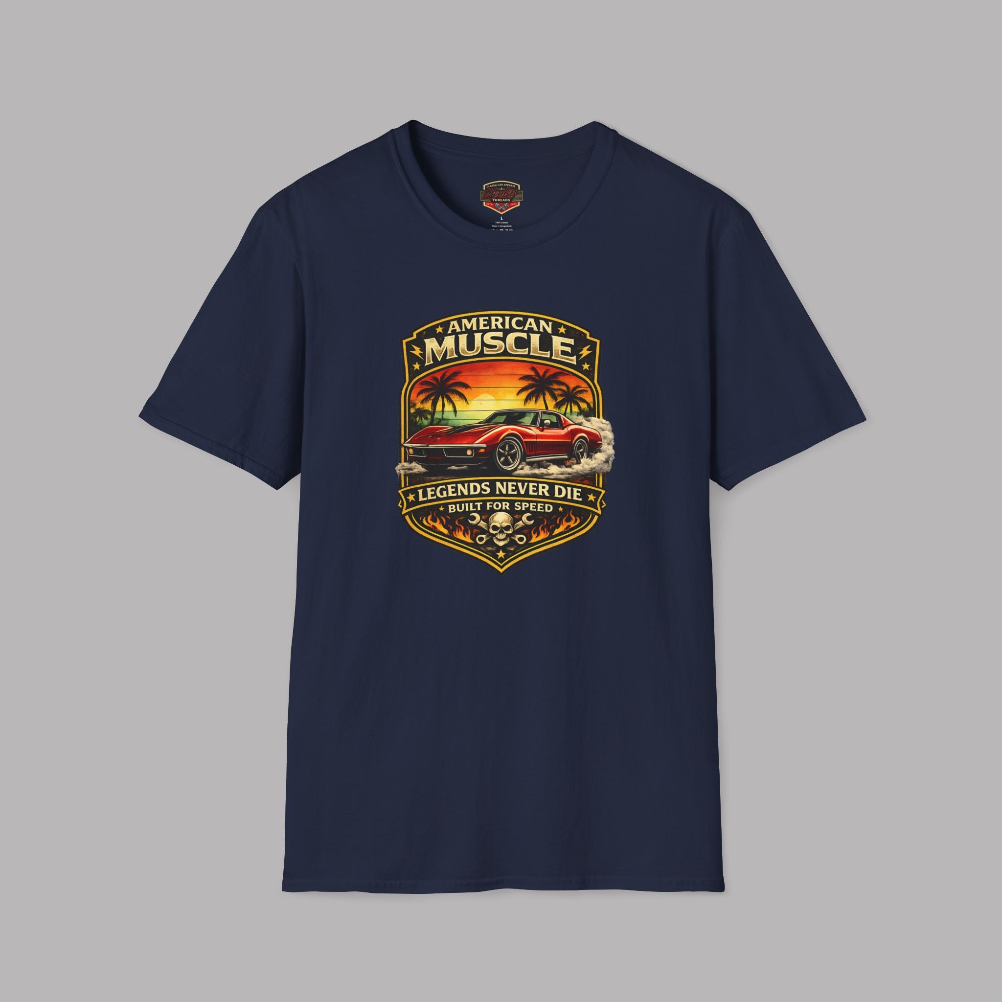Navy blue t-shirt with a graphic design of a car and sunset on a gray background