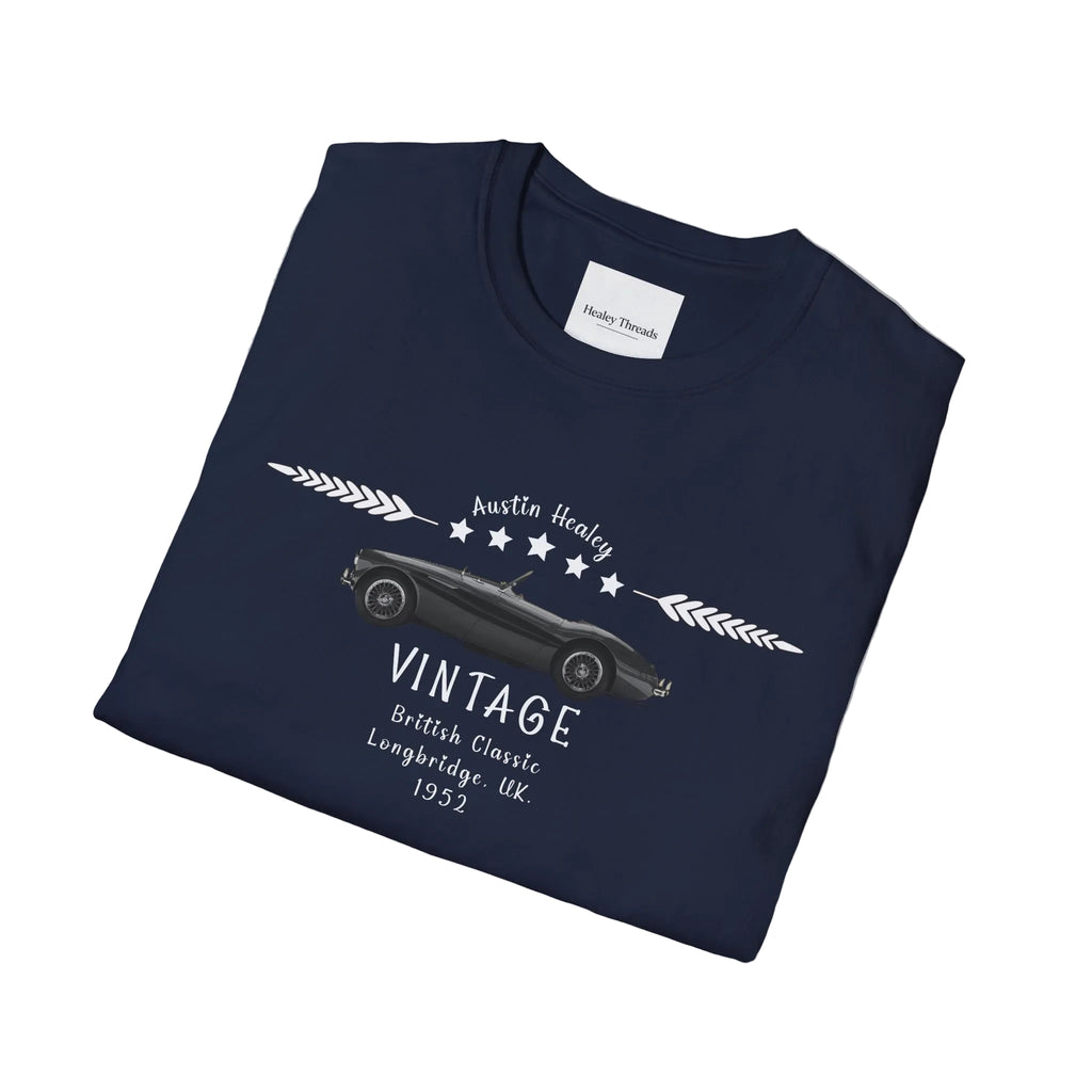 Folded navy blue t-shirt with vintage car design on a white background