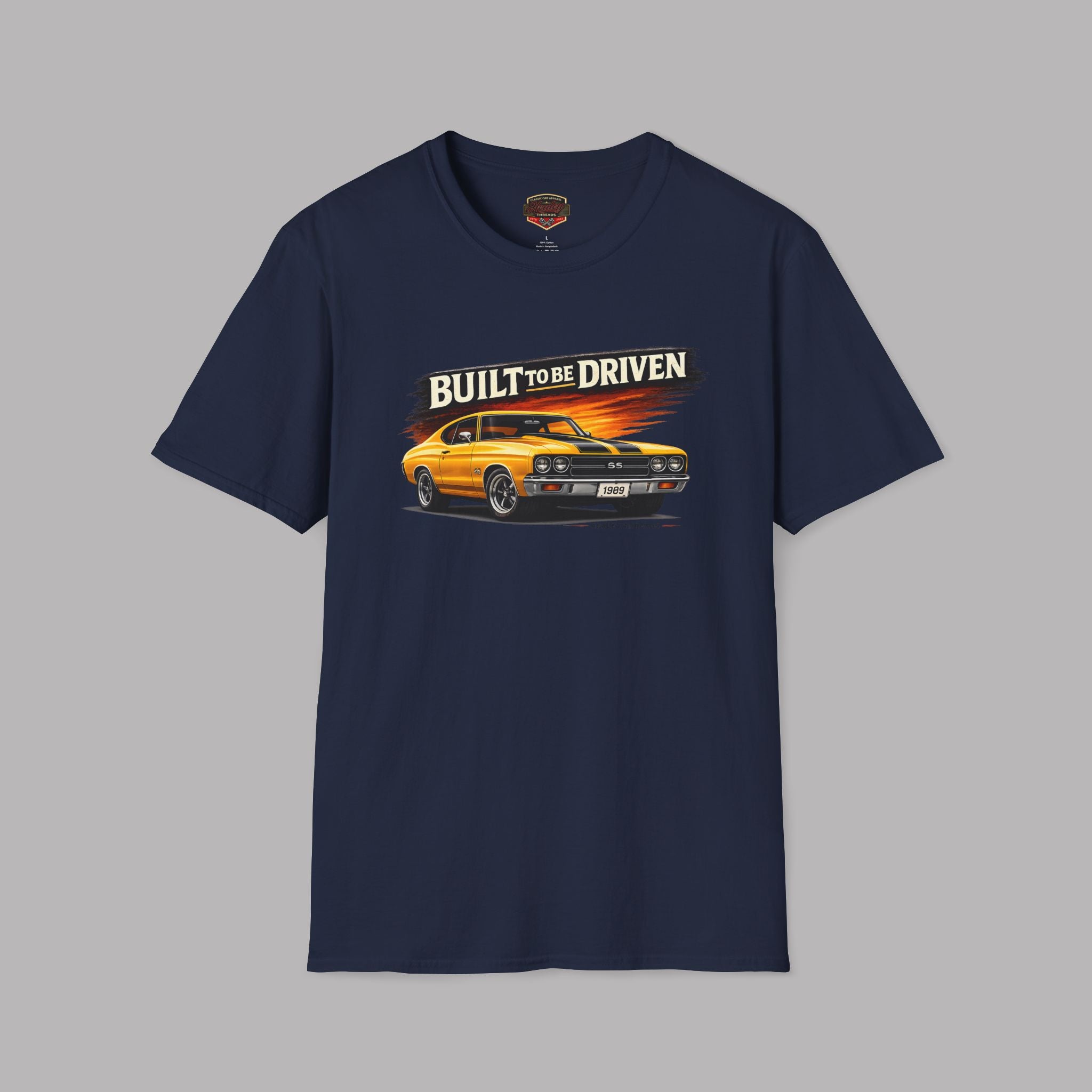 Navy blue t-shirt with a graphic of a car and 'Built to be Driven' text on a gray background