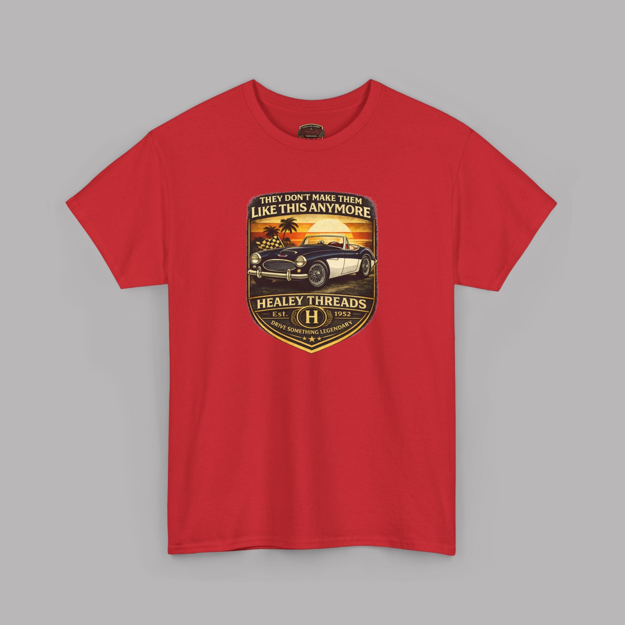 Red t-shirt with a graphic car design on a gray background