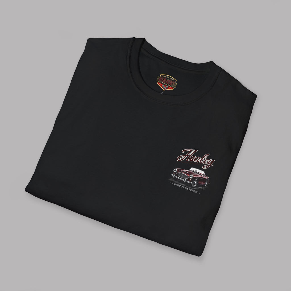 Folded black t-shirt with graphic design on a white background