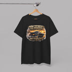 Black t-shirt with a classic car graphic design on a hanger against a gray background
