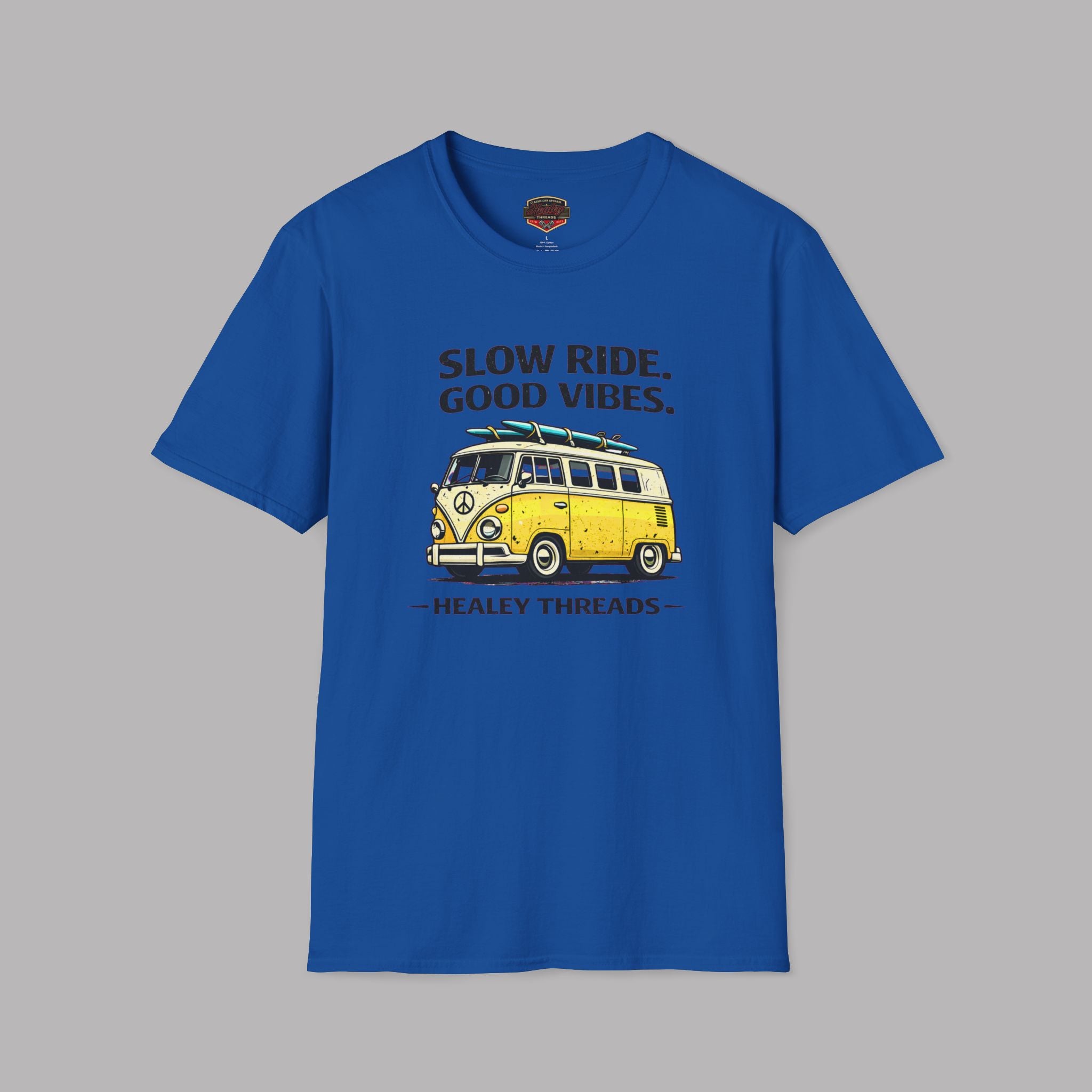 Royal blue t-shirt with a yellow van graphic and text on a gray background
