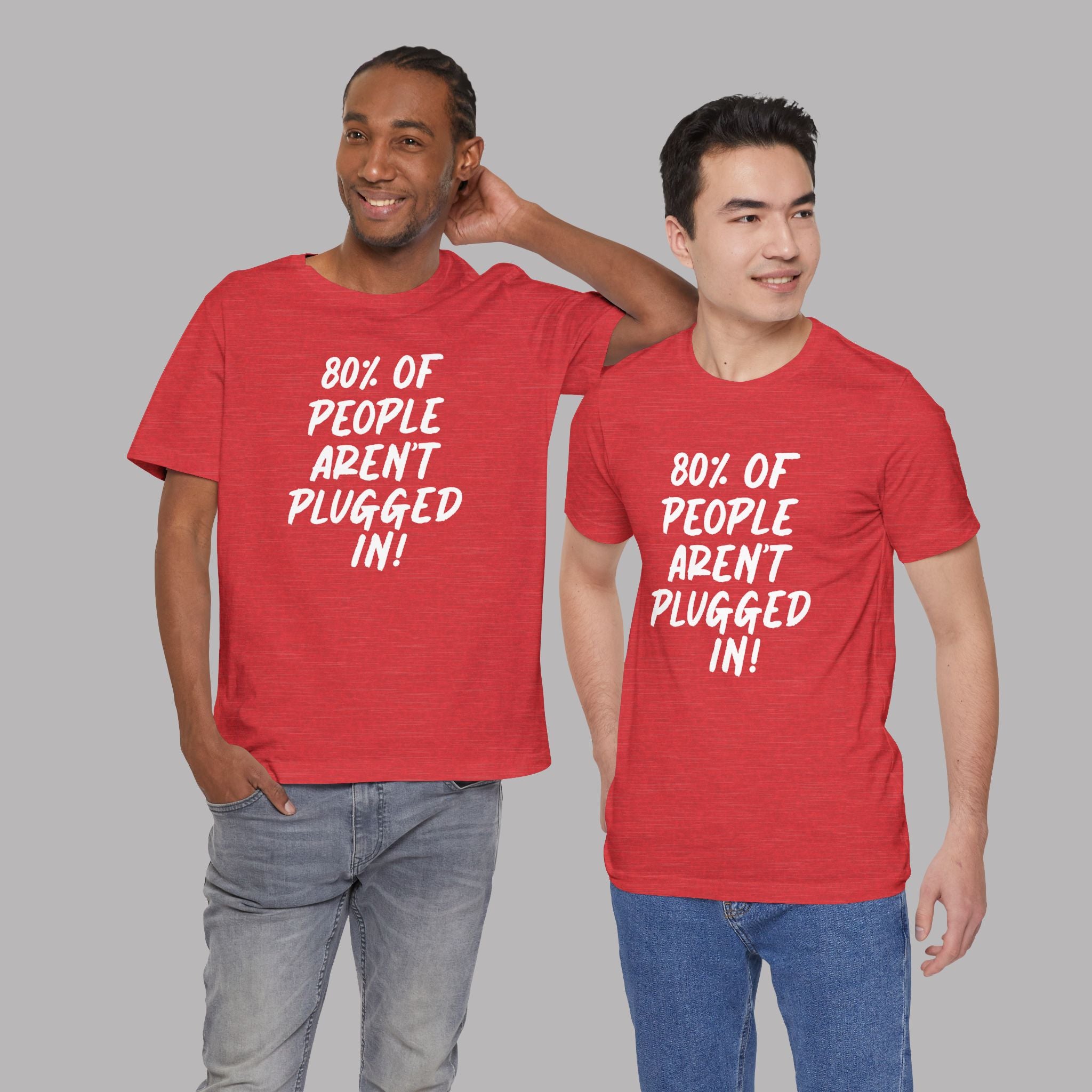 Two men wearing red t-shirts with a humorous message "80% of People Aren't Plugged In" on a gray background