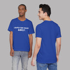 Two people wearing blue t-shirts with a humorous message  t-shirts with white text "Cheaper than therapy. Barely." on a gray background 