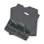 Folded gray t-shirt with Austin Healey car design on a white background