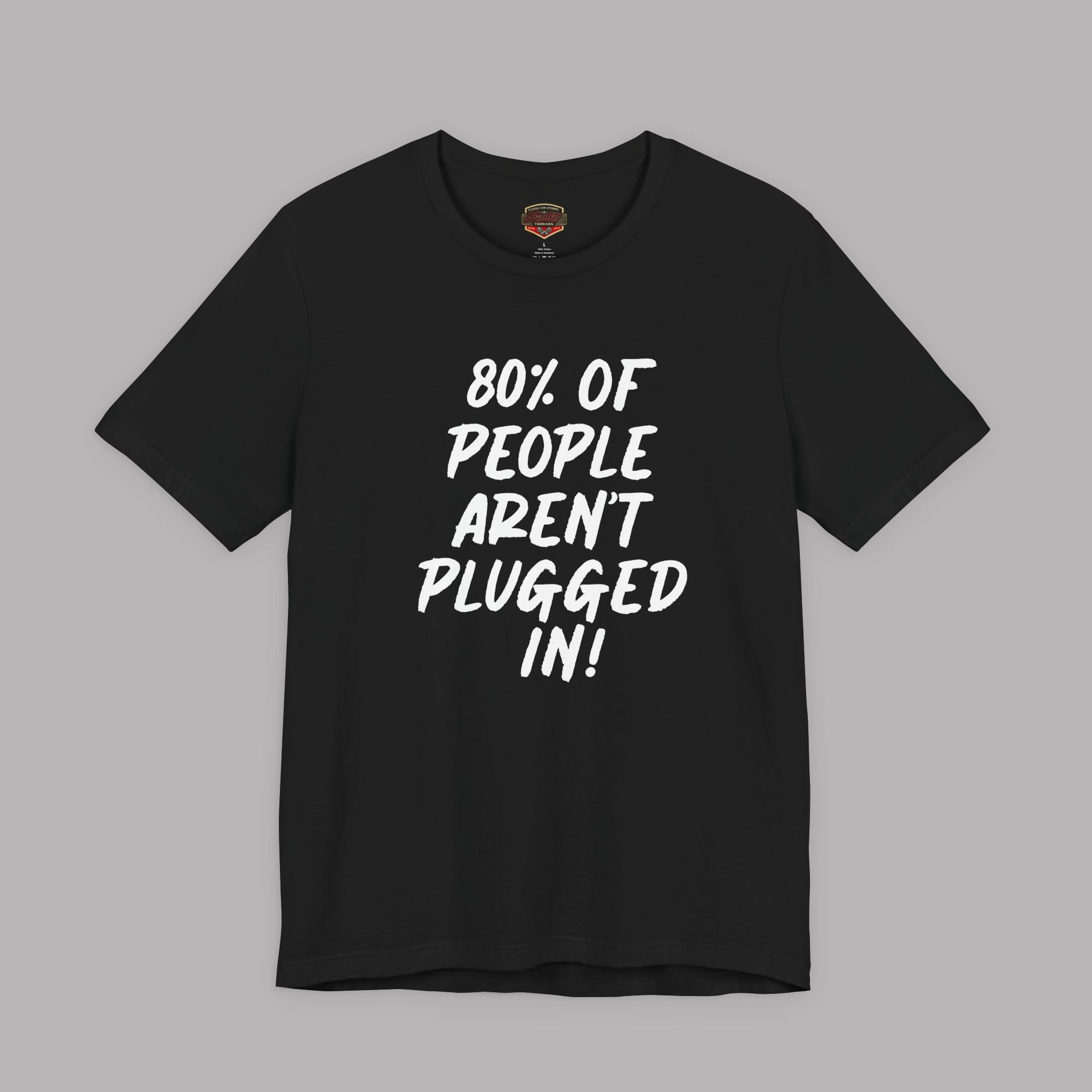 Black t-shirt with white text "80% of People Aren't Plugged In" on a gray background