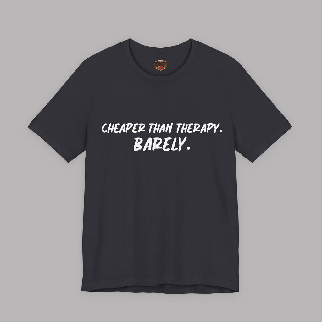 Dark gray t-shirt with white text "Cheaper than therapy. Barely." on a gray background