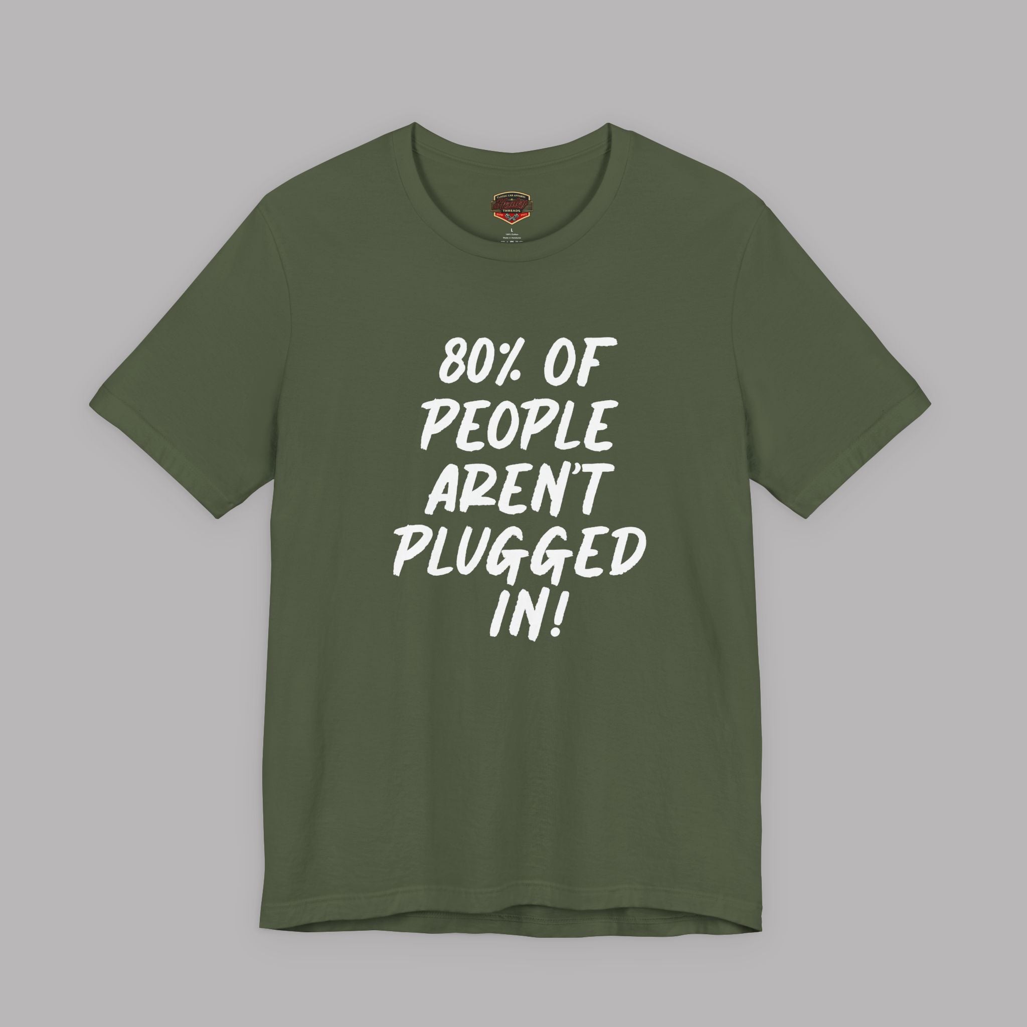 An military green short-sleeve t-shirt with white text on the front reading '80% OF PEOPLE AREN'T PLUGGED IN!' displayed against a solid gray background.