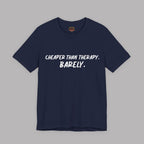 Navy blue  t-shirt with white text "Cheaper than therapy. Barely." on a gray background