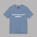 Steel blue  t-shirt with white text "Cheaper than therapy. Barely." on a gray background