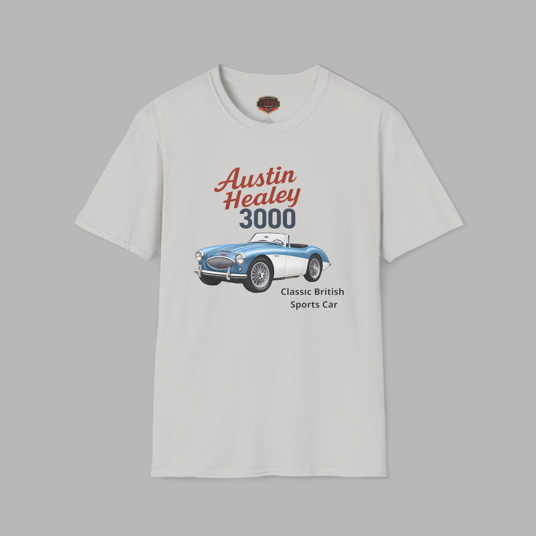 A ice gray short-sleeve crewneck t-shirt featuring a graphic print of a classic Austin Healey 3000 sports car with red and navy text, displayed on a solid gray background.