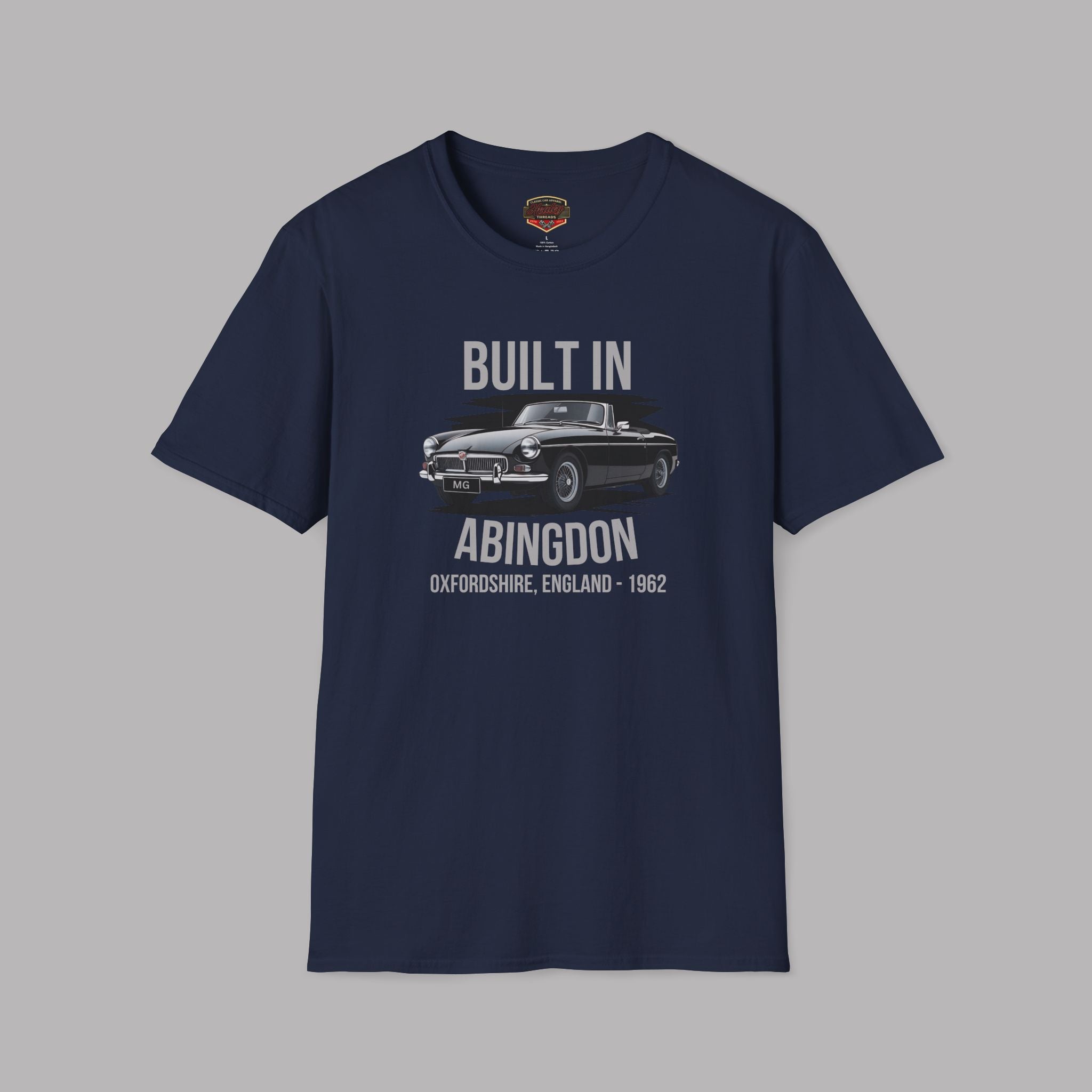 Navy blue t-shirt with gray text and a MGB car graphic design on a white background