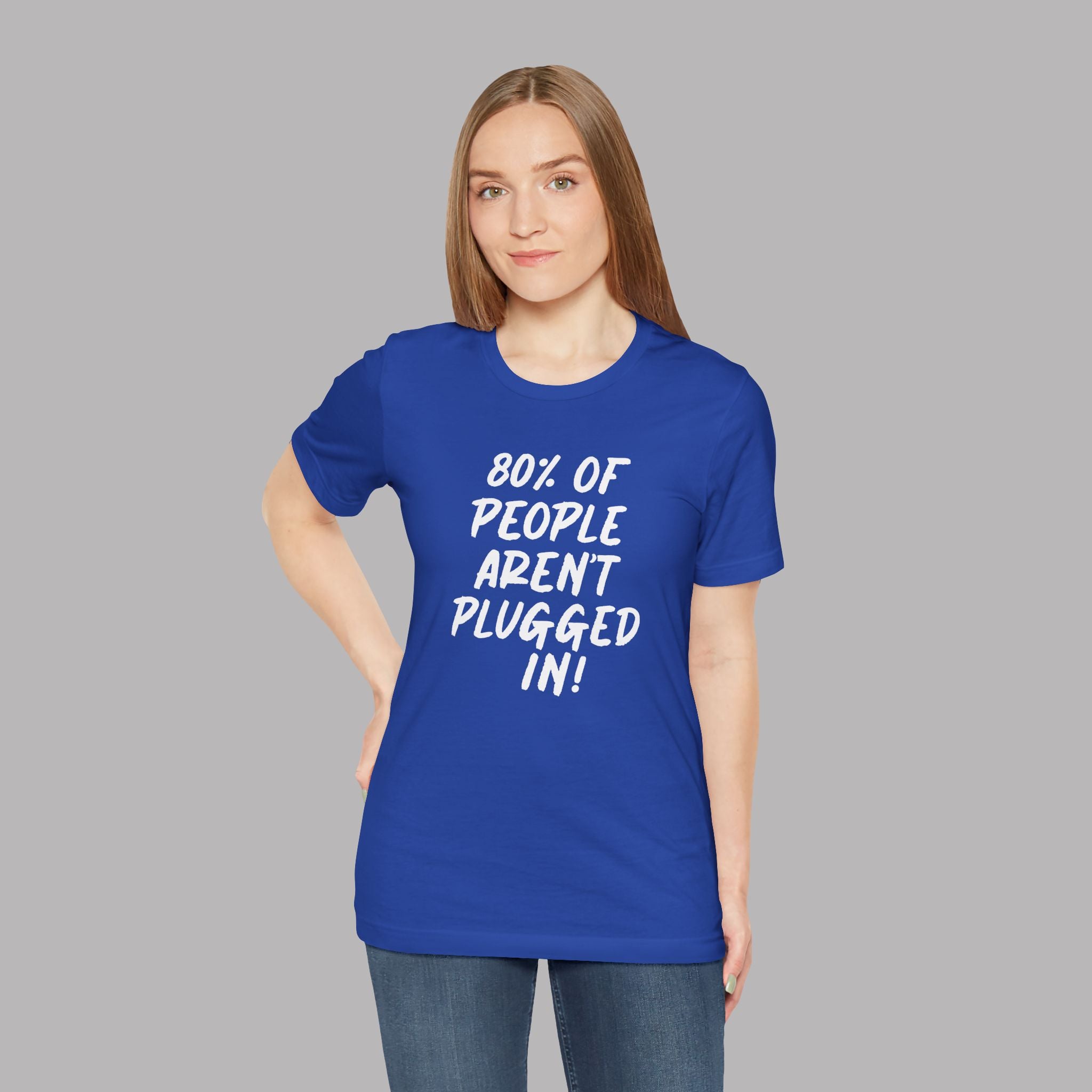 Woman wearing a royal blue t-shirt with text "80% of People Aren't Plugged In" on a gray background