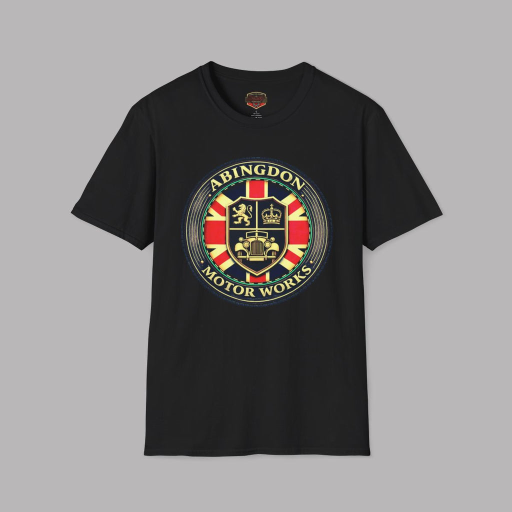 Black t-shirt featuring a circular 'Abingdon Motor Works' crest graphic on the chest, styled in a flat-lay arrangement on a gray background