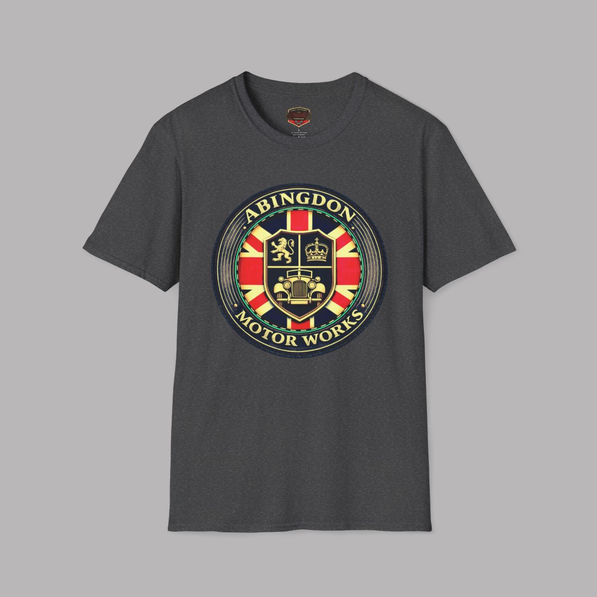 A dark heather gray crewneck t-shirt featuring a large circular 'Abingdon Motor Works' crest graphic on the chest, displayed against a solid gray background.