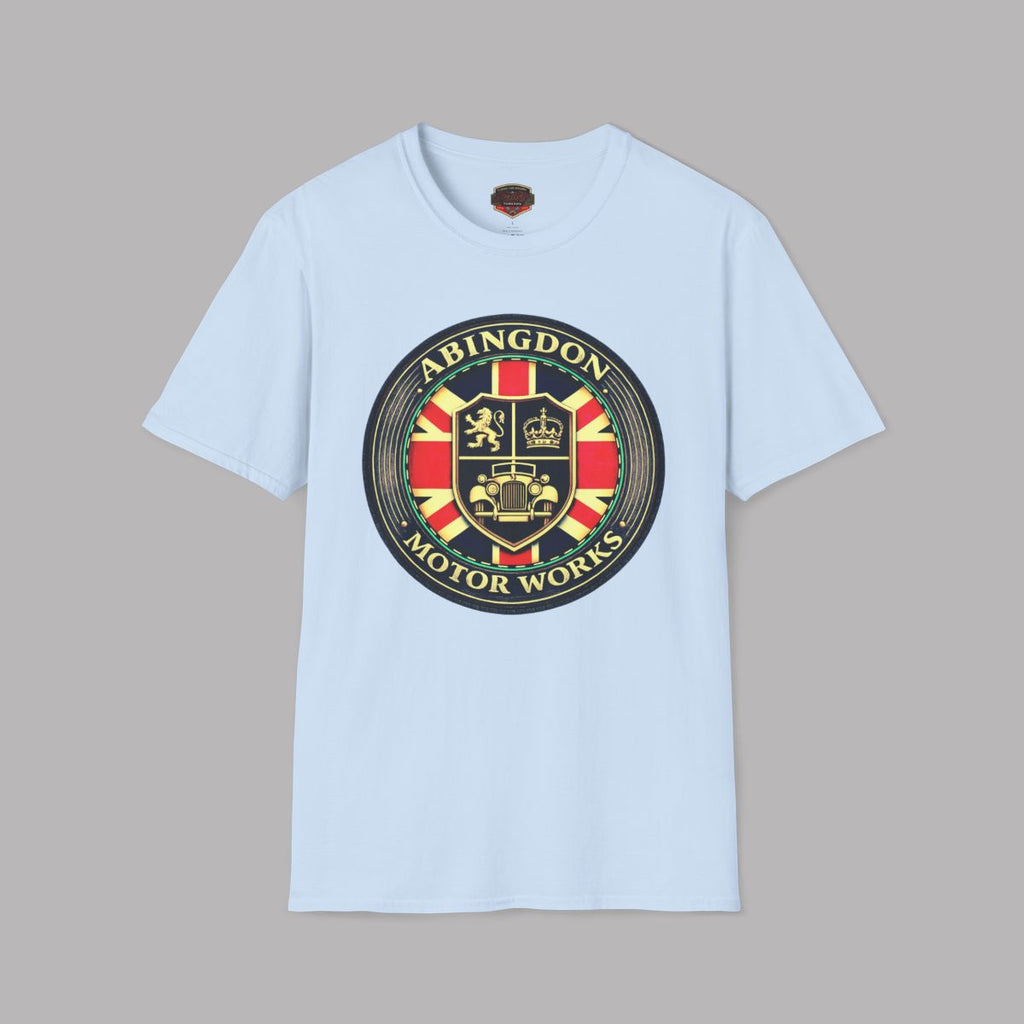 A light blue short-sleeve crewneck t-shirt featuring a large circular 'Abingdon Motor Works' crest graphic printed on the chest, displayed against a solid gray background.