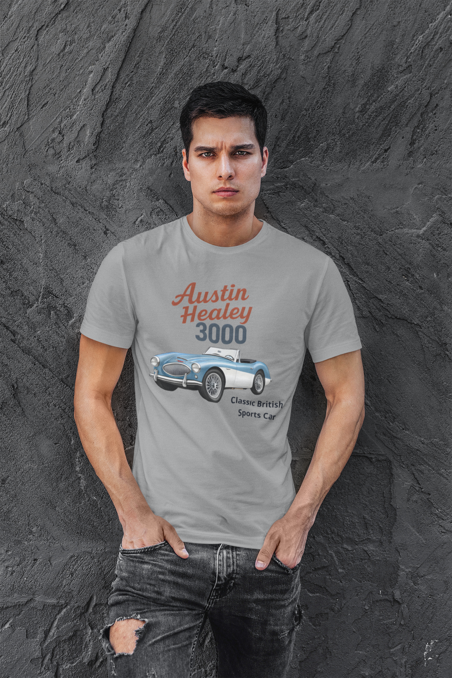 Man wearing a gray t-shirt with Austin Healey 3000 graphic against a textured gray background
