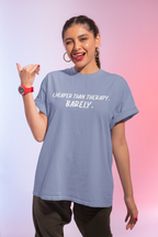 Woman wearing a light blue t-shirt with text on a gradient background